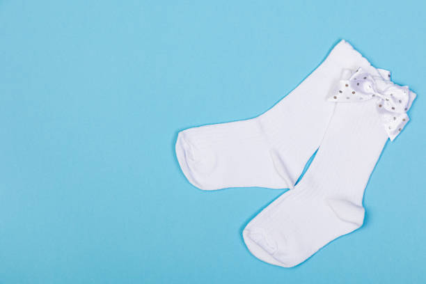 istock high white children's socks with big bows for festive clothes on a blue background 1408378894