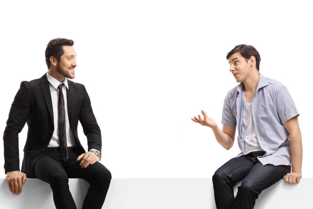 istock Businessman and a casual man sitting on a panel and talking 1408379069
