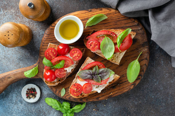 istock Tomato ricotta bruschetta with basil and olive oil 1408382840