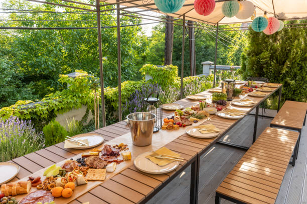 istock Food served outdoor on a long table 1408383267