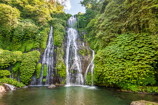 The beautiful twin-waterfall Banyumala in the rainforest in Bali