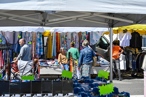 Saint Cast-le-Guildo, Brittany, France, July 4 , 2022 - People on the Saint Cast-Le-Guildo weekly market on the Atlantic promenade