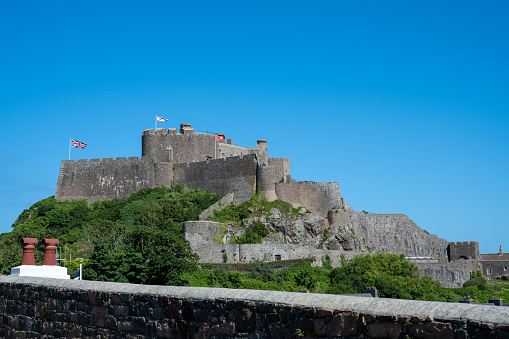 The iconic EMont Orgueil Castle guarding the entrance to Gorey harbour of the British Crown Dependency of Jersey, Channel Islands, British Isles.