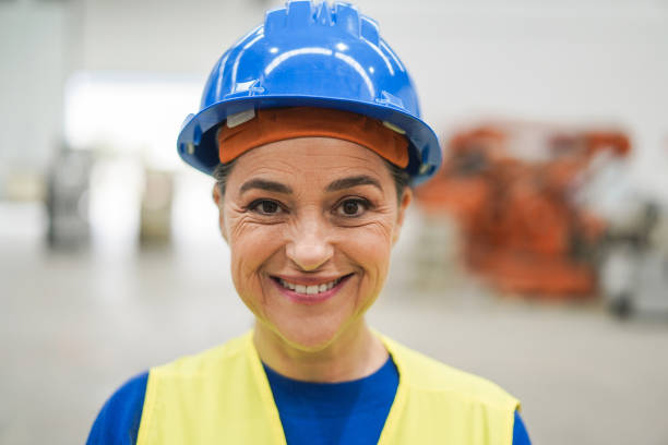 istock Happy engineer woman working inside robotic factory - Industrial and technology concept 1408388244