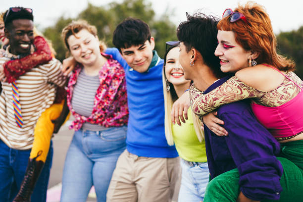 istock Young diverse people having fun outdoor laughing together 1408388362