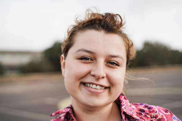 istock Happy curvy girl smiling on camera - Focus on face 1408388375