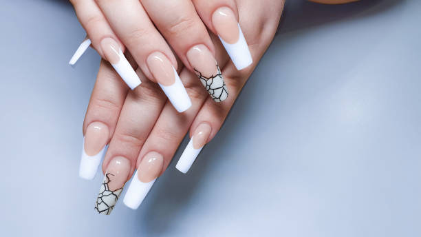 istock Acrylic nail extension. Manicure. Nail correction. Hands in the foreground. 1408389036