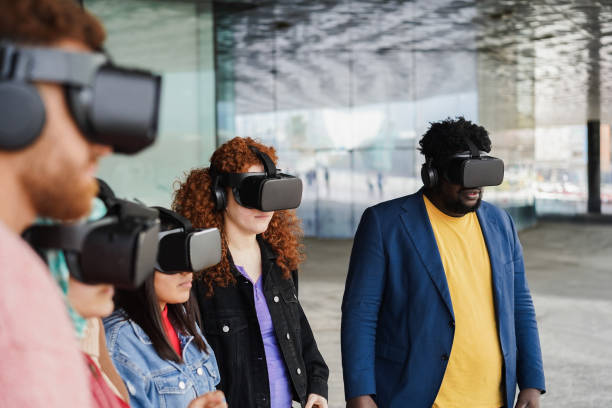 istock Young people wearing virtual glasses outdoor - Metaverse concept 1408390105