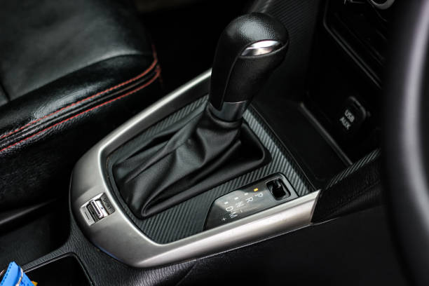 istock automatic transmission shift selector in the car interior. Closeup a manual shift of modern car gear shifter. 4x4 gear shift 1408390900