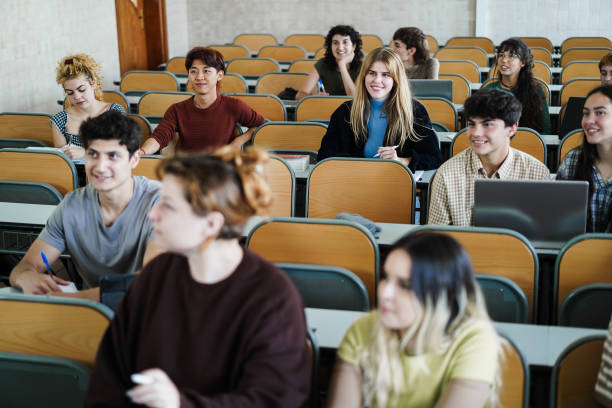 istock Young multiethnic students working together inside classroom at school university 1408391265