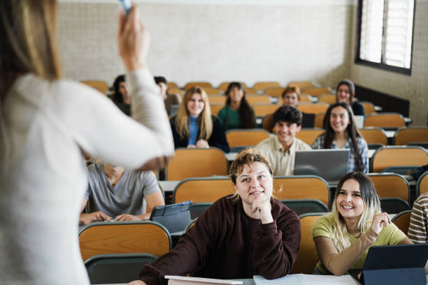 istock Mature teacher working with students inside classroom at school university 1408391274