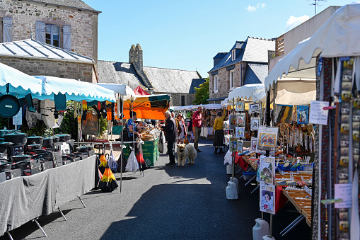 Plurien, Brittany, France, July 1 , 2022 - People on the weekly summer market of local producers and craftsmen in Plurien, Brittany