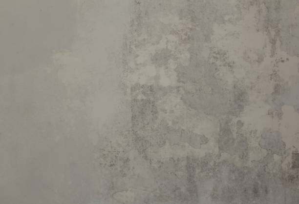 istock Weathered cement wall texture with scratches and damages. An old concrete wall background. 1408393562