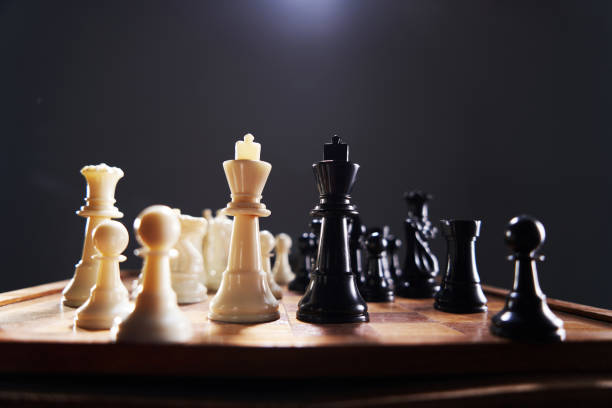 istock black and white chess piece s on black background 1408394688