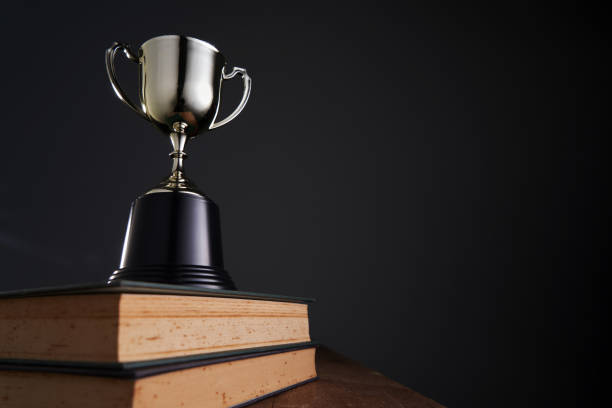 istock gold trophy against black background 1408394883