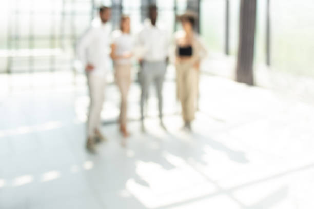 istock Blurred image of business people standing in the office 1408394907