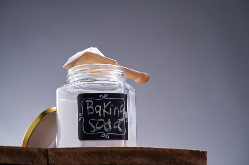 jar with label and spoon of baking soda