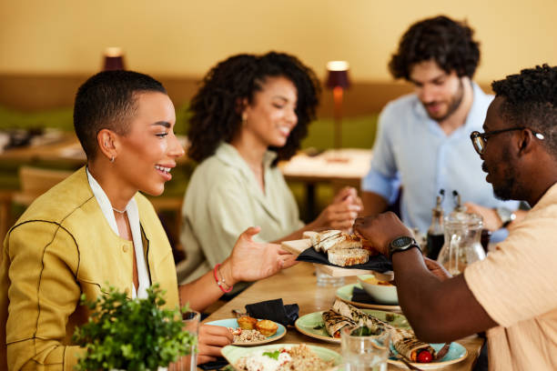 istock A multicultural group of friends is having dinner in the restaurant. 1408395341