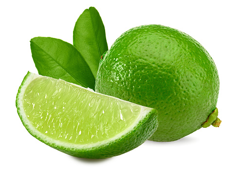 green lime with green leaf and cut of lime isolated on white background. clipping path