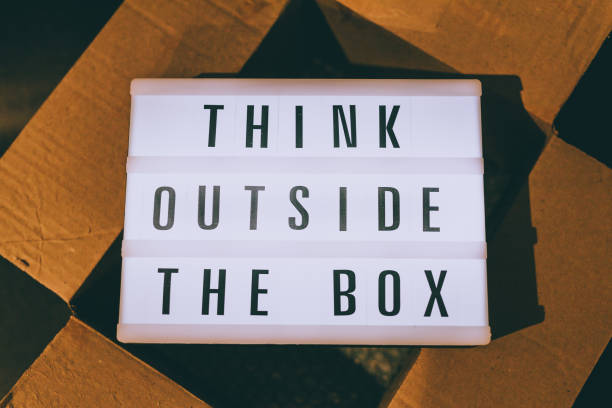 istock Think outside the box message on lightbox on top of open parcel 1408401730