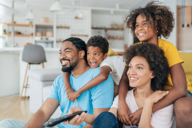 istock Family watching television 1408402088
