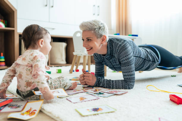 istock Mother Exercise With Her Baby At Home 1408402094