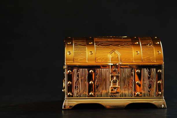 istock Gold treasure chest on a black textured background. 1408402584