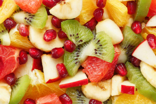 istock Fruit salad close-up in full screen, as a background. 1408403556