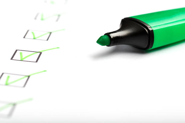 istock Green marker with markers on the checklist sheet. 1408403811