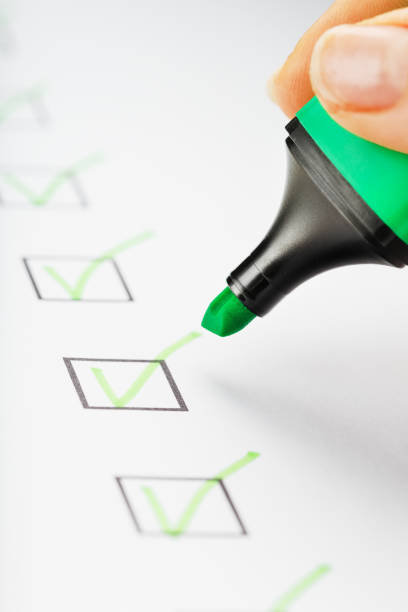 istock Green marker with markers on the checklist sheet. 1408403848
