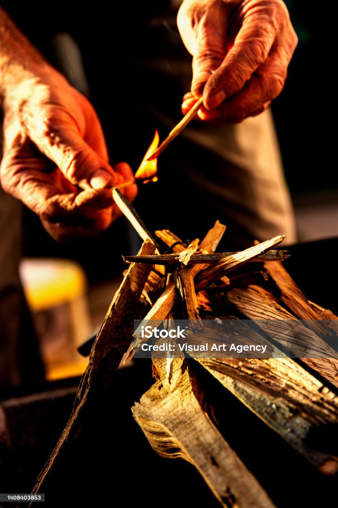 Man Making Fire On Grill Adult Stock Photo