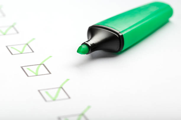 istock Green marker with markers on the checklist sheet. 1408404132