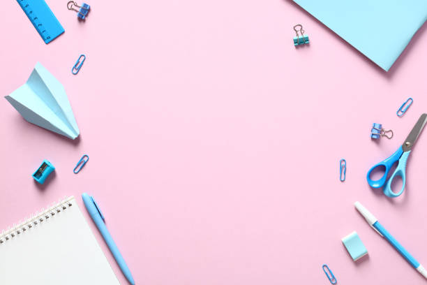 istock Back to school concept. Flat lay blue school supplies on pink table. Creative layout. 1408405466