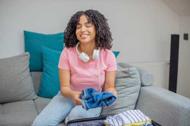 istock Woman organizing her luggage 1408407353
