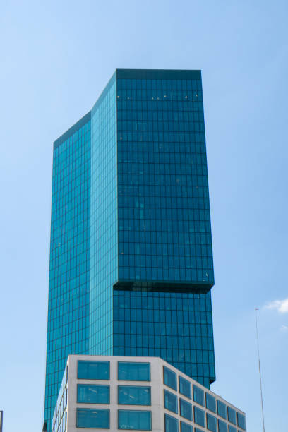 istock Zurich Prime Tower skyscraper green glass office building. Low wide angle view, sunny summer day, blue sky, no people 1408408949