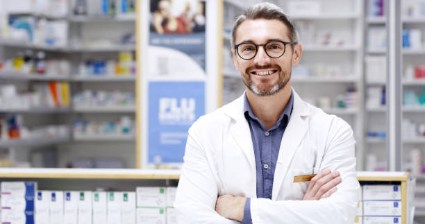 istock Copyspace alongside a happy pharmacist standing with arms crossed while working in a chemist. Mature caucasian man and drugstore manager ready to assist customers with trusted pharmaceutical advice 1408409011