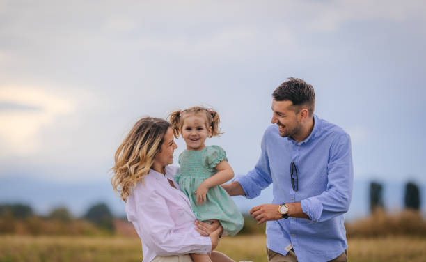 istock Happy young family in the park 1408409042