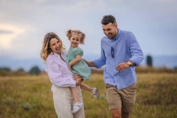 istock Happy young family in the park 1408409045