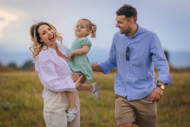 istock Happy young family in the park 1408409054