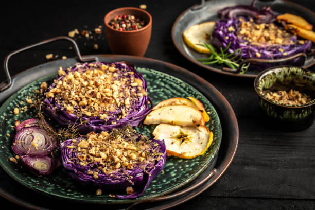 istock Vegan roasted red cabbage steaks with nuts, quince, onions and apples Top view, flat lay 1408411277