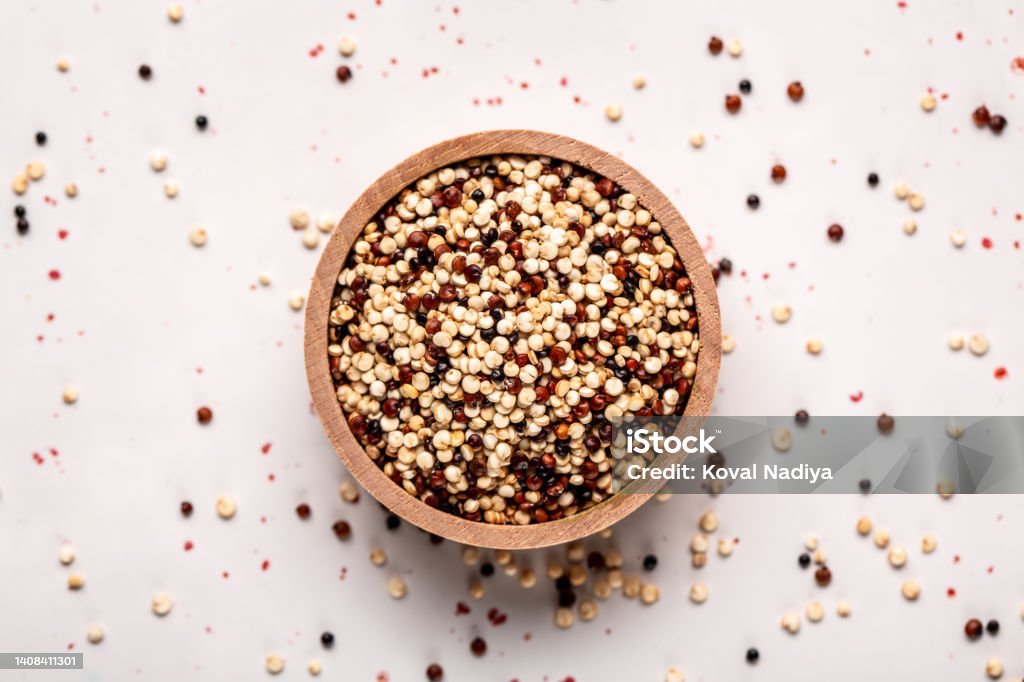 close Set of three varieties of uncooked quinoa on white background, top view close Set of three varieties of uncooked quinoa on white background, top view. Quinoa Stock Photo