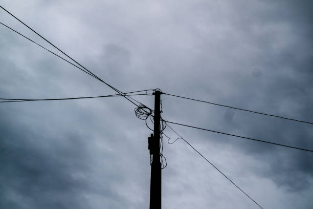 istock Electric poles and cloudy sky 1408411381