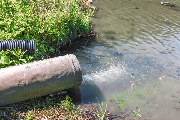 istock Domestic waste water flows down the sewer drainage pipe into the river 1408412236