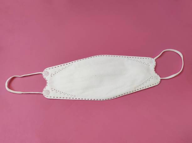 istock KF94 white mask on pink background 1408414558