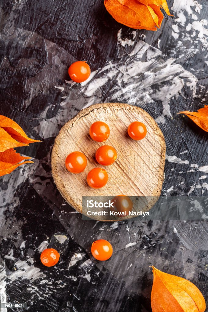 Physalis fruit Physalis Peruviana with husk on wooden background, vertical image, place for text Physalis fruit Physalis Peruviana with husk on wooden background, vertical image, place for text. Seed Stock Photo