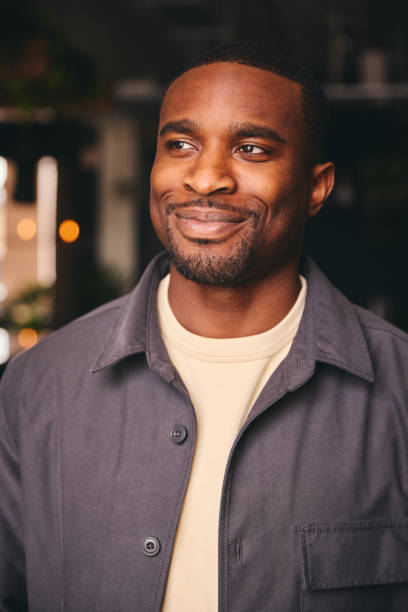 istock Smiling Young Black Male Standing In Office Looking At Camera 1408417683