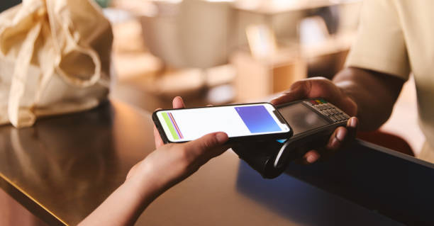 istock Customer Paying Using Smartphone Mobile Payment NFC Contactless Technology In Retial Store 1408417715