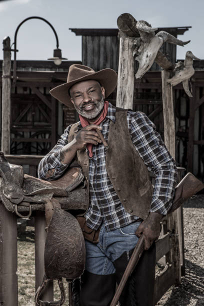istock Handsome Black Cowboy in an authentic wild west setting 1408418486
