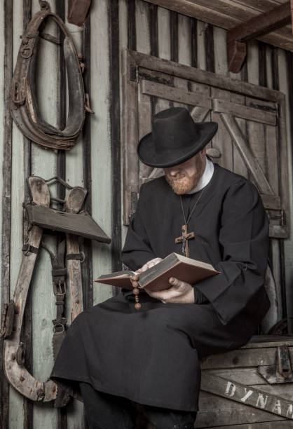 istock Handsome redhead Cowboy priest in an authentic wild west setting 1408418986