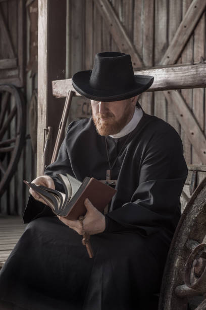 istock Handsome redhead Cowboy priest in an authentic wild west setting 1408419601